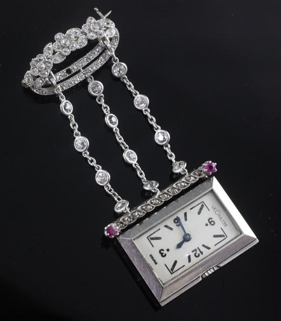 A 1920s rose cut diamond and ruby set staybrite steel Le Coultre lapel watch with diamond set suspension brooch, 55mm.